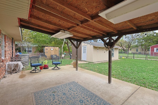 view of patio featuring an outbuilding