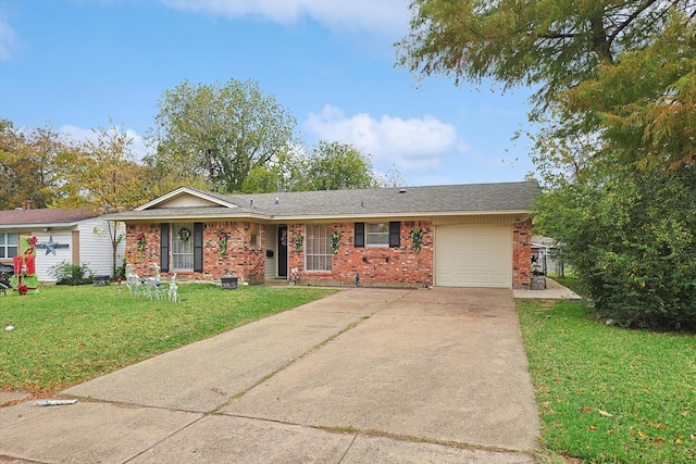 ranch-style home featuring a garage and a front yard