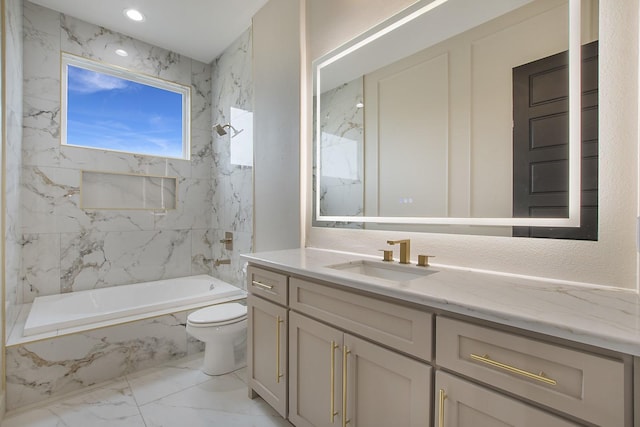 full bathroom featuring tiled shower / bath combo, vanity, and toilet