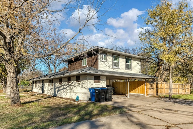 view of property exterior with a carport