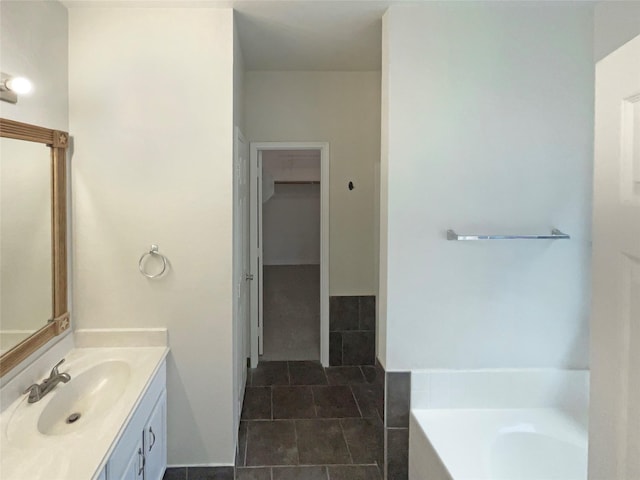 bathroom featuring vanity and a bathtub