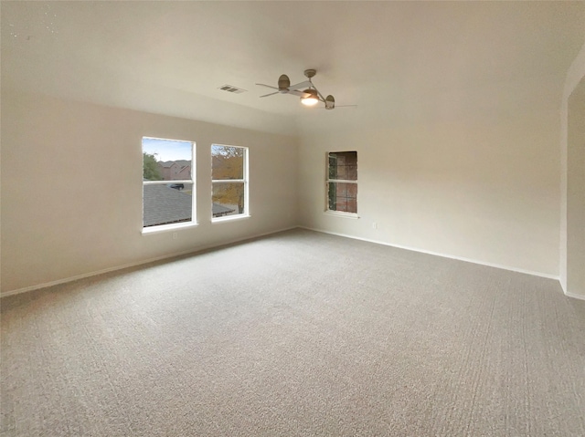 carpeted empty room with ceiling fan