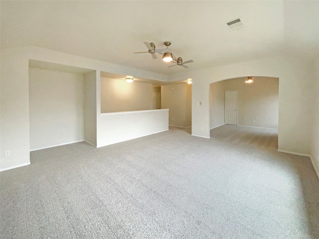 empty room with ceiling fan and carpet