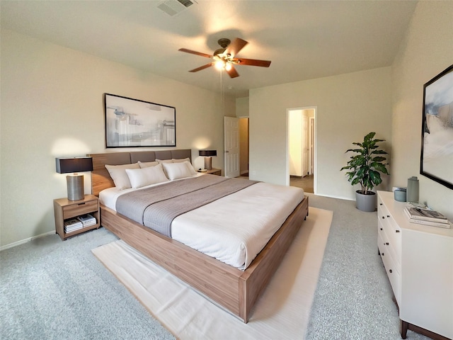 bedroom featuring light carpet and ceiling fan