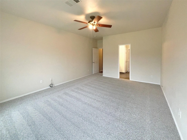 empty room featuring carpet floors and ceiling fan