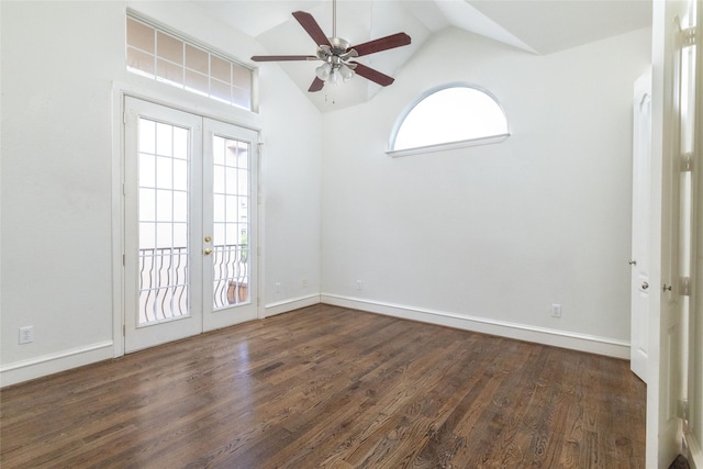 empty room featuring ceiling fan, french doors, high vaulted ceiling, and dark hardwood / wood-style floors