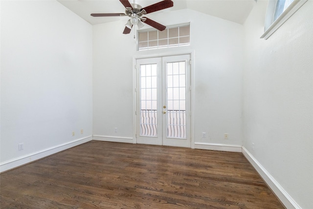 empty room featuring lofted ceiling, ceiling fan, french doors, and dark hardwood / wood-style floors