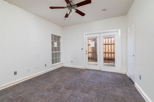 spare room with ceiling fan