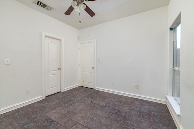 spare room with ceiling fan