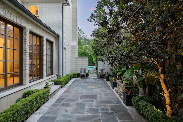 view of patio terrace at dusk