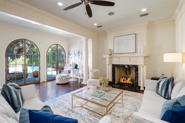 living room with hardwood / wood-style floors, ceiling fan, crown molding, and french doors