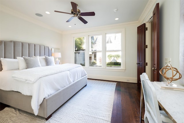 bedroom featuring ceiling fan, hardwood / wood-style floors, and ornamental molding