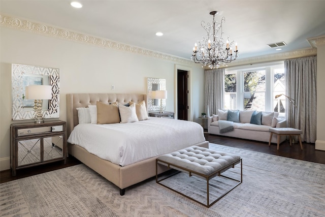 bedroom with wood-type flooring and an inviting chandelier