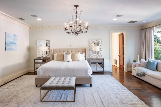 bedroom featuring dark hardwood / wood-style flooring and a chandelier