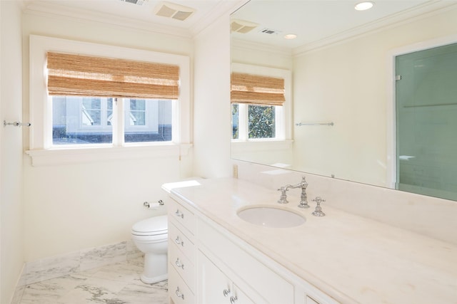 bathroom with crown molding, vanity, a healthy amount of sunlight, and toilet