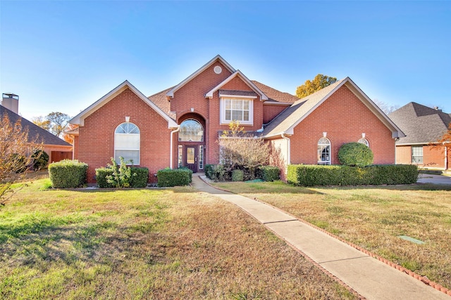 view of property with a front lawn