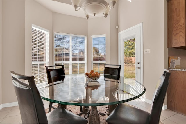 dining area featuring light tile patterned floors