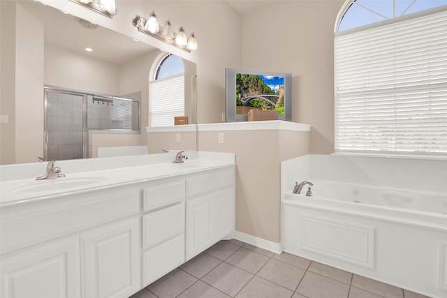 bathroom featuring vanity, tile patterned floors, and shower with separate bathtub