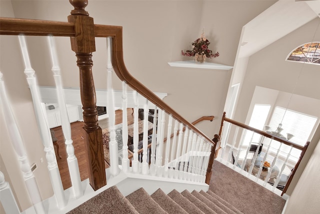 stairs featuring lofted ceiling