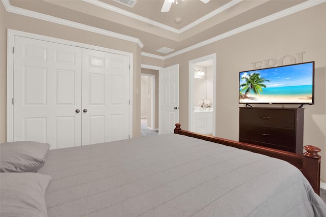 bedroom with ceiling fan, a closet, crown molding, and ensuite bath