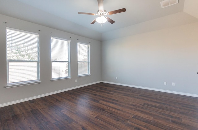 empty room with ceiling fan and dark hardwood / wood-style flooring