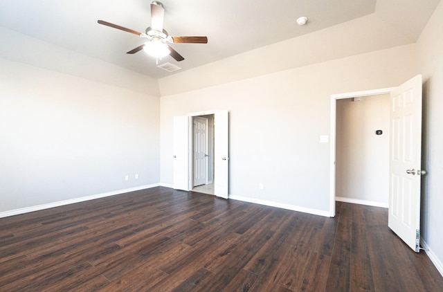 empty room featuring dark hardwood / wood-style flooring and ceiling fan