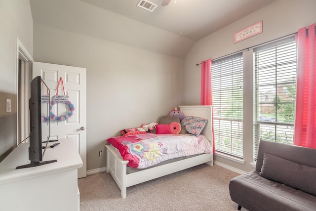 bedroom with lofted ceiling and carpet