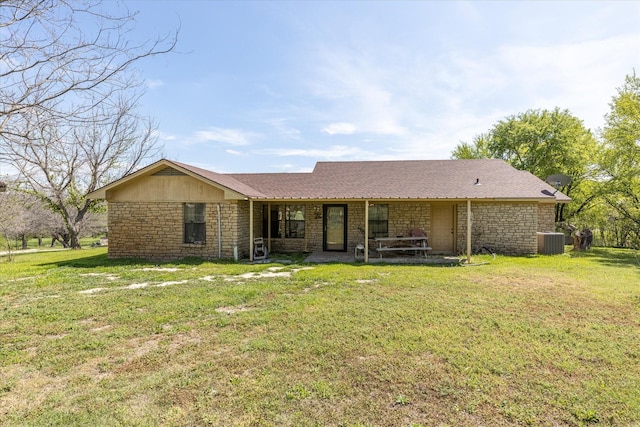 view of front of house with a front lawn and cooling unit