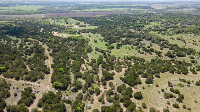 birds eye view of property featuring a rural view