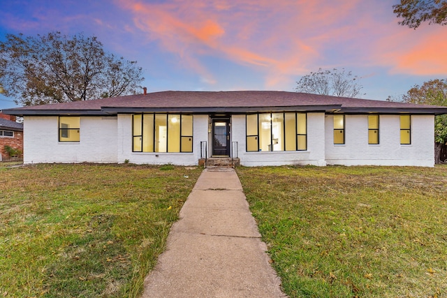 view of front of house with a lawn