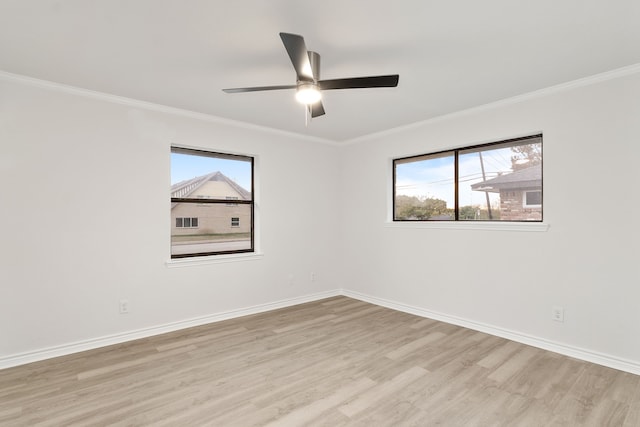 empty room featuring crown molding, ceiling fan, and light hardwood / wood-style floors