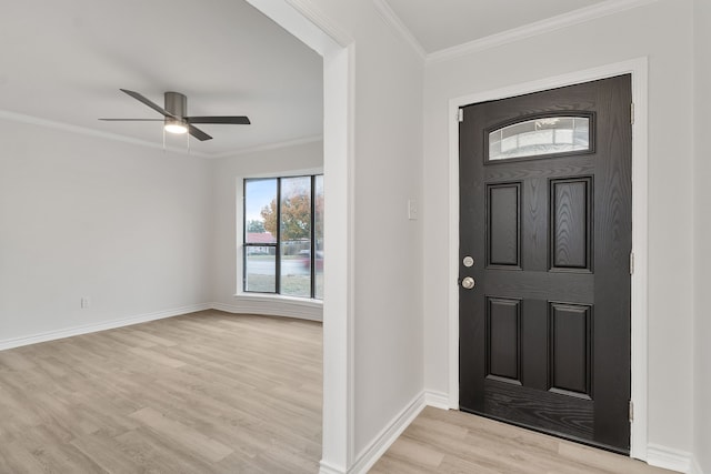 entrance foyer with ceiling fan, light hardwood / wood-style floors, and crown molding