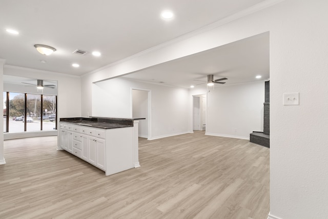 kitchen featuring white cabinets, light hardwood / wood-style flooring, ceiling fan, and crown molding