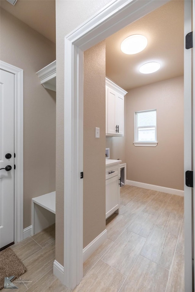 laundry room featuring cabinets and washer hookup