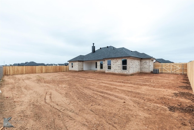 back of house featuring central AC