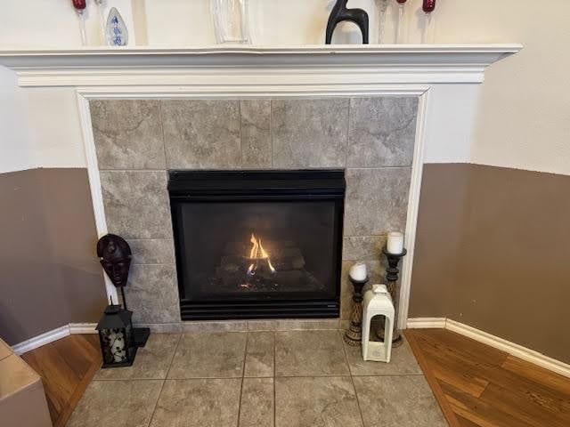 details featuring a fireplace and hardwood / wood-style floors