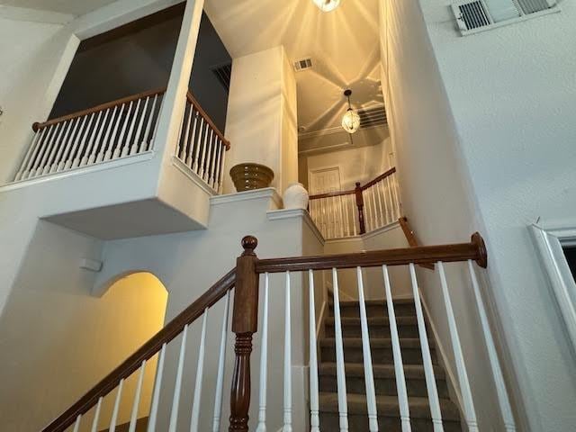 stairs with a towering ceiling