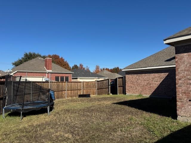 view of yard featuring a trampoline