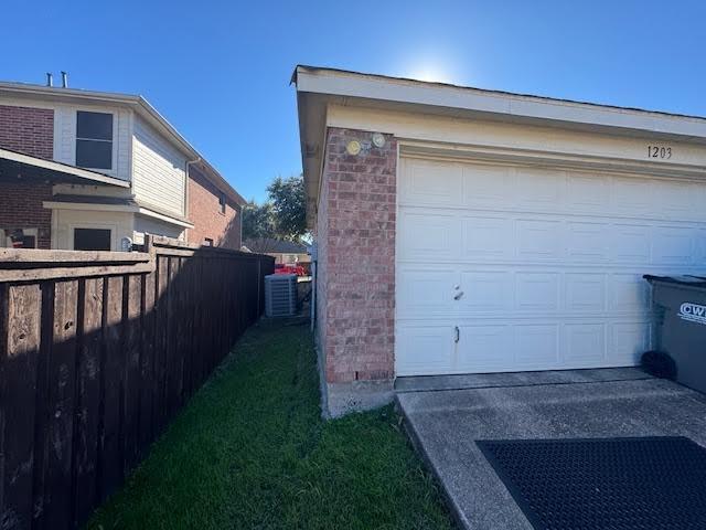 garage featuring central air condition unit