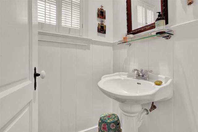 1316 Preston Dr, Sherman, TX 75092 - half bathroom with a decorative wall, plenty of natural light, and wainscoting