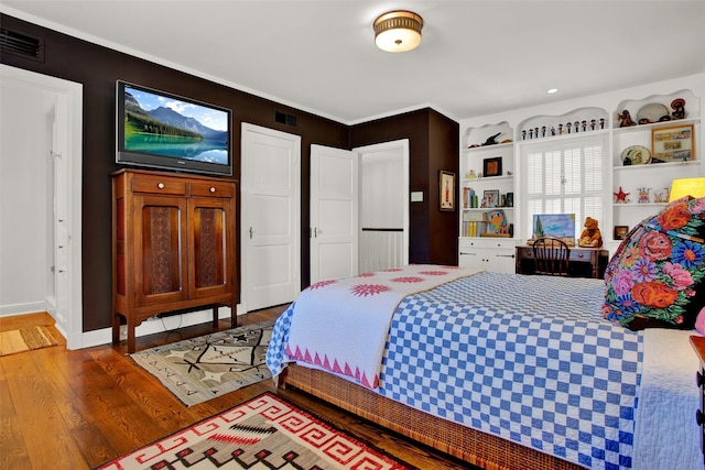 bedroom featuring hardwood / wood-style flooring