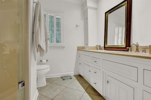 bathroom with tile patterned flooring, vanity, toilet, and crown molding