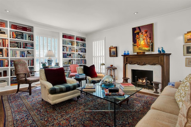 1316 Preston Dr, Sherman, TX 75092 - living area featuring wood finished floors, ornamental molding, a premium fireplace, recessed lighting, and built in features