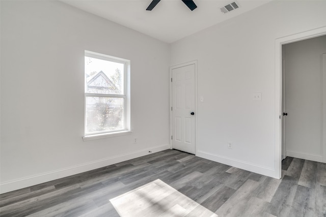 unfurnished bedroom with hardwood / wood-style floors and ceiling fan