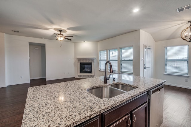 kitchen with dishwasher, dark hardwood / wood-style floors, and a wealth of natural light