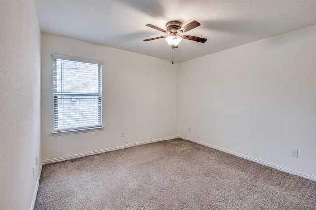 empty room with carpet flooring and ceiling fan