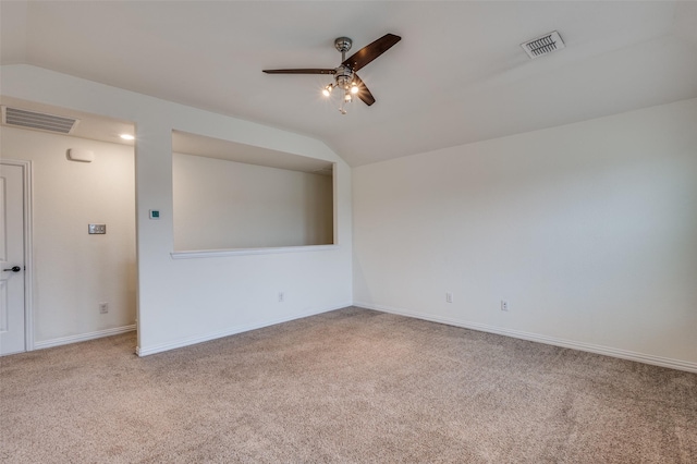 carpeted empty room with ceiling fan and lofted ceiling