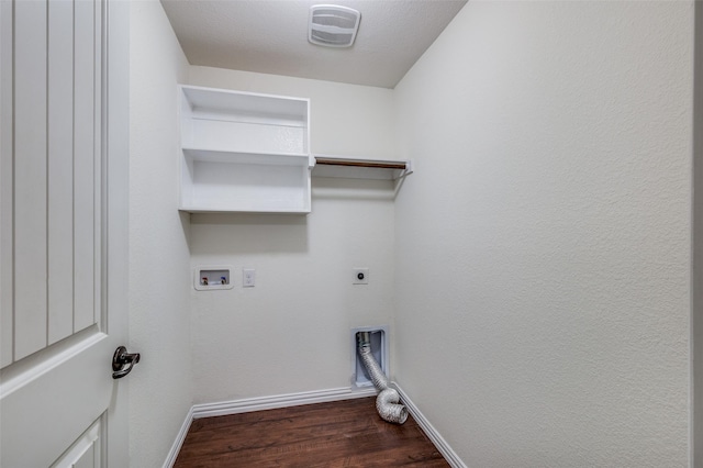 clothes washing area featuring a textured ceiling, hookup for a washing machine, dark hardwood / wood-style floors, and hookup for an electric dryer