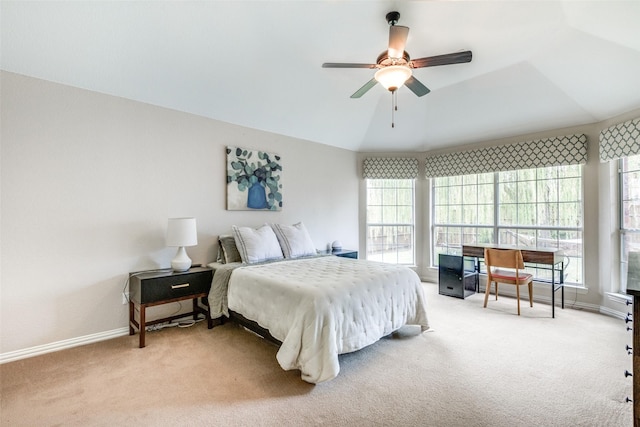 carpeted bedroom featuring ceiling fan and lofted ceiling