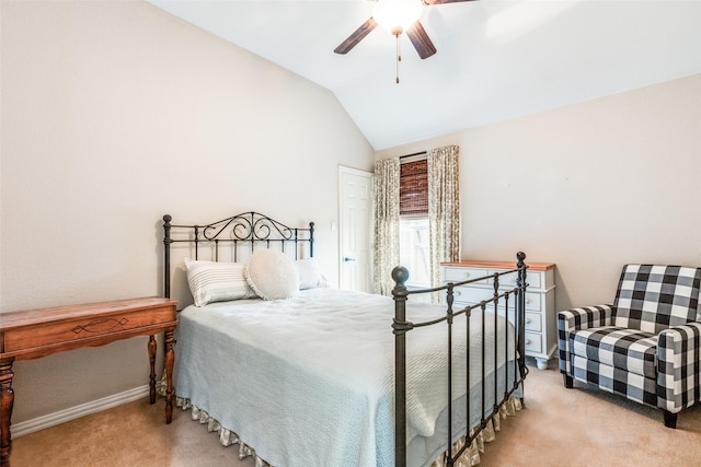 carpeted bedroom with ceiling fan and lofted ceiling